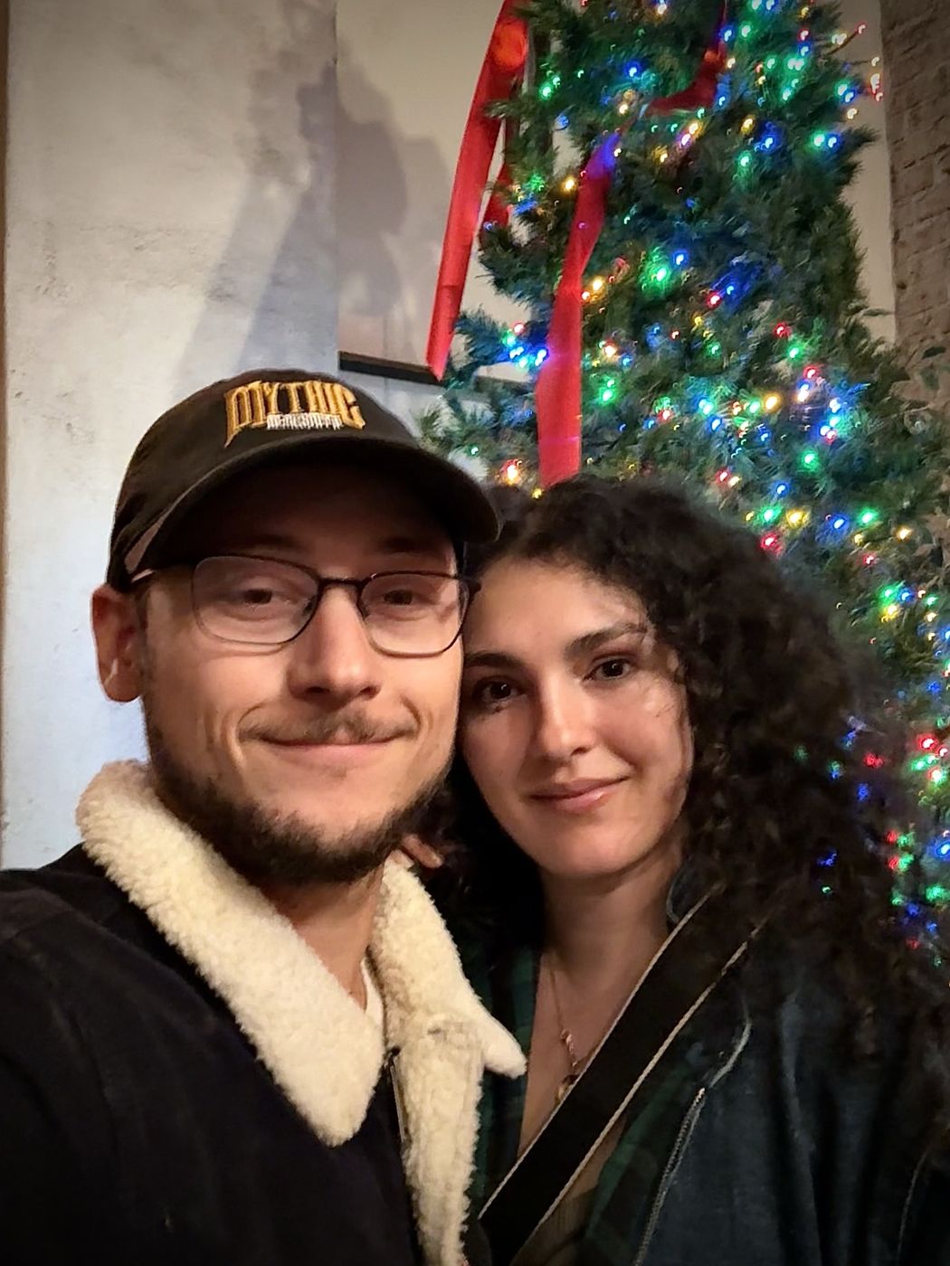 Tristan and Ileana by a Christmas tree